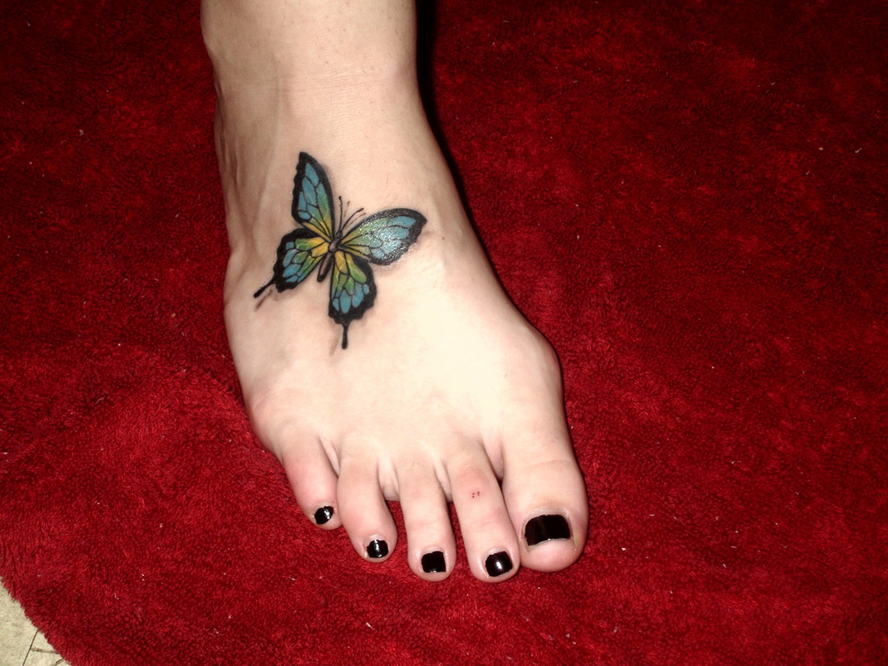 Small butterfly tattoos on foot