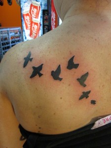 Small Black Bird Tattoo